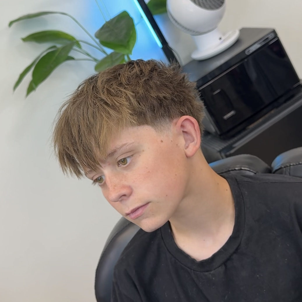 Fringe fade haircut, side view